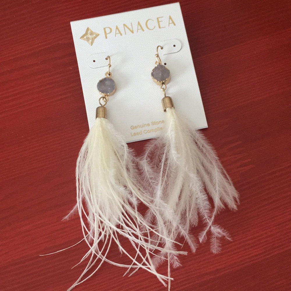 Never worn! Gorgeous Panacea feather earring